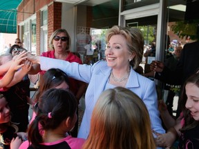 Hillary Clinton greets children during a campaign event in front of the Henderson county court house May 2, 2008 in Hendersonville, North Carolina.