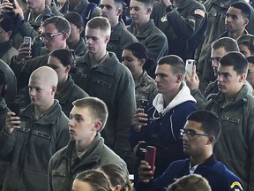 Air Force Academy cadets use their cellphones to record a message from Lt Gen. Jay Silveria, about race relations during lunch, Friday, Sept. 29, 2017 at the Air Force Academy in Colorado Springs, Colo. Silveria, the leader of the Air Force Academy delivered a poignant and stern message on race relations in a speech to thousands of cadets after someone wrote racial slurs on message boards outside the dorm rooms of five black students. (Jerilee Bennett/The Gazette via AP)