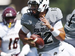 Colorado quarterback Steven Montez, front, scrambles to evade Texas State linebacker Frankie Griffin in the first half of an NCAA college football game Saturday, Sept. 9, 2017, in Boulder, Colo. (AP Photo/David Zalubowski)