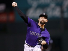 Colorado Rockies starting pitcher Tyler Chatwood throws to a Miami Marlins batter during the first inning of a baseball game Monday, Sept. 25, 2017, in Denver. (AP Photo/David Zalubowski)