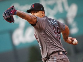 CORRECTS CAPTION - Arizona Diamondbacks starting pitcher Taijuan Walker throws to the plate against the Colorado Rockies during the first inning of a baseball game Friday, Sept. 1, 2017, in Denver. (AP Photo/Jack Dempsey)