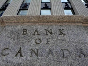 The Bank of Canada building is pictured in Ottawa on September 6, 2011. The economy's surprisingly powerful second-quarter performance is pushing forecasters to change their outlooks ??? starting with predictions for Wednesday's central bank rate announcement.THE CANADIAN PRESS/Sean Kilpatrick