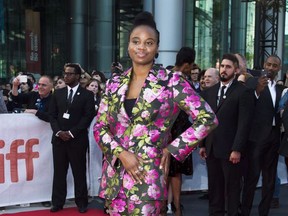 Director Dee Rees poses for photographs on the red carpet for the movie "Mudbound" during the 2017 Toronto International Film Festival in Toronto on Tuesday, September 12, 2017. Rees could never have anticipated her exploration of white supremacy in the Second World War epic would echo stories looming large in modern-day headlines. THE CANADIAN PRESS/Nathan Denette