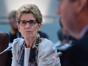 Ontario Premier Kathleen Wynne takes part in the meeting of First Ministers in Ottawa on Friday, Dec. 9, 2016. A member of the Ontario legislature is apologizing to Premier Kathleen Wynne for comments made in a radio interview after the premier's lawyers warned he could face a defamation lawsuit.  THE CANADIAN PRESS/Sean Kilpatrick