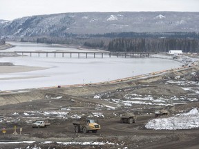 The Site C Dam location is seen along the Peace River in Fort St. John, B.C., Tuesday, April 18, 2017. A preliminary report raises more questions than answers about the future of the controversial $8.8-billion Site C dam, with the British Columbia Utilities Commission saying it needs more information before it can make a recommendation. THE CANADIAN PRESS/Jonathan Hayward