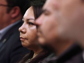 Sheila North Wilson, grand chief of Manitoba Keewatinowi Okimakanak, listens to an RCMP announcement at a press conference in Winnipeg, Friday, March 18, 2016. First Nations leaders in Manitoba want a greater say in the national inquiry into missing and murdered Indigenous women and girls. Sheila North Wilson, grand chief of Manitoba Keewatinowi Okimakanak, which represents First Nations communities across northern Manitoba, says improvements in the way the inquiry communicates with families are badly needed. THE CANADIAN PRESS/John Woods
