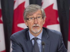 Privacy commissioner Daniel Therrien is seen during a press conference in Ottawa, Tuesday, September 27, 2016. The federal privacy czar says Canadians should be very concerned about their cellphones, computers and other electronic devices being searched by U.S. border agents. THE CANADIAN PRESS/Adrian Wyld