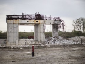 The remains of the 800-megawatt gas-fired power plant, which had it's construction canceled by the then Liberal Government of Ontario prior to the provincial general election of 2011, sits in Mississauga on May 18 2014. A trial of two former top political aides in the Ontario premier's office is slated to begin in Toronto today. David Livingston and Laura Miller are charged with breach of trust, mischief and unlawful use of a computer. The politically sensitive case involves allegations of illicit email destruction in the office of former Liberal premier Dalton McGuinty. The emails were about the Liberals' decision to cancel two gas plants just before the 2011 election, costing taxpayers about $1.1 billion. THE CANADIAN PRESS/Chris Young