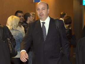 Frank Zampino, former chairman of the city of Montreal executive committee, leaves the courtroom after a brief appearance to set a trial date on fraud charges Monday, April 29, 2013 in Montreal.