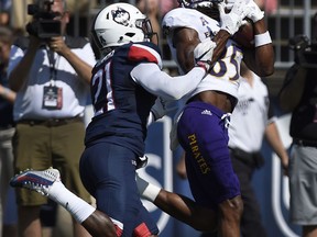 East Carolina wide receiver Davon Grayson (85) catches a touchdown over Connecticut defensive back Jamar Summers (21), left, during the first half of an NCAA college football game at Pratt & Whitney Stadium at Rentschler Field, Sunday, Sept. 24, 2017, in East Hartford, Conn. (AP Photo/Jessica Hill)