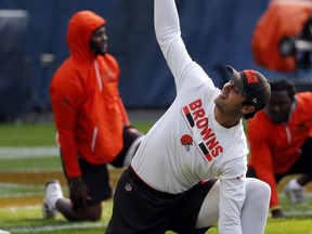 Cleveland Browns quarterback Brock Osweiler warms up before an NFL football game against the Chicago Bears, Thursday, Aug. 31, 2017, in Chicago. (AP Photo/Charles Rex Arbogast)