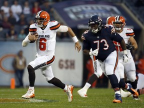 Cleveland Browns quarterback Cody Kessler (6) runs against Chicago Bears defensive tackle John Jenkins (73) during the first half of an NFL football game, Thursday, Aug. 31, 2017, in Chicago. (AP Photo/Nam Y. Huh)