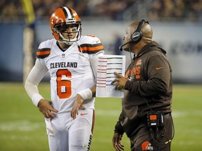 Cleveland Browns quarterback Cody Kessler (6) talks to head coach Hue Jackson during the first half of an NFL football game against the Chicago Bears, Thursday, Aug. 31, 2017, in Chicago. (AP Photo/Charles Rex Arbogast)