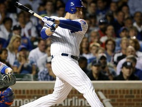 Chicago Cubs' Anthony Rizzo hits a single off New York Mets starting pitcher Seth Lugo during the first inning of a baseball game Thursday, Sept. 14, 2017, in Chicago. (AP Photo/Charles Rex Arbogast)
