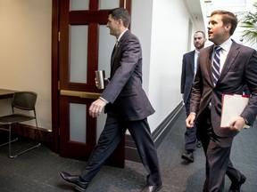 House Speaker Paul Ryan of Wis., center, arrives for a GOP caucus meeting on Capitol Hill, Wednesday, Sept. 13, 2017, in Washington. (AP Photo/Andrew Harnik)
