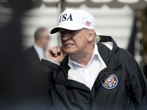 President Donald Trump takes a question from a member of the media on the South Lawn of the White House in Washington, Thursday, Sept. 14, 2017, after meeting with people impacted by Hurricane Irma in Florida. (AP Photo/Andrew Harnik)