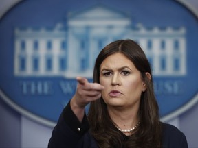 White House press secretary Sarah Huckabee Sanders points to a reporter as she takes questions during a news briefing at the White House in Washington, Friday, Sept. 1, 2017. (AP Photo/Carolyn Kaster)