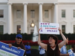 Julia Paley, of Arlington, Va., with the DMV Sanctuary Congregation Network, dances with a sign that reads "DACA Don't Destroy Dreamers Dreams" during a rally supporting Deferred Action for Childhood Arrivals, or DACA, outside the White House, in Washington, Monday, Sept. 4, 2017. A plan President Donald Trump is expected to announce Tuesday for young immigrants brought to the country illegally as children was embraced by some top Republicans on Monday and denounced by others as the beginning of a "civil war" within the party. (AP Photo/Carolyn Kaster)