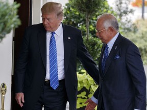 President Donald Trump greets Malaysian Prime Minister Najib Razak at the White House, Tuesday, Sept. 12, 2017, in Washington. (AP Photo/Evan Vucci)