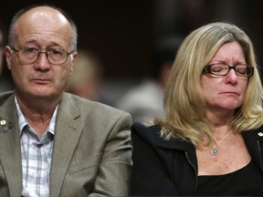 Sid Palmer, left, and Theresa Palmer, who lost their son Navy IC2 Logan Palmer, 23, of Decatur, Ill., on the USS McCain collision, react during a Senate Armed Services hearing Tuesday, Sept. 19, 2017, on Capitol Hill in Washington.   (AP Photo/Jacquelyn Martin)