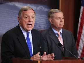 Sen. Dick Durbin, D-Ill., left, with Sen. Lindsey Graham, R-S.C., speaks during a news conference on Capitol Hill in Washington, Tuesday, Sept. 5, 2017, to discuss their bipartisan Dream Act, which would allow young immigrants who grew up in the United States to earn lawful permanent residence and eventually American citizenship. (AP Photo/Manuel Balce Ceneta)