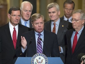 Sen. Lindsey Graham, R-S.C., joined by, from left, Sen. John Barrasso, R-Wyo., Majority Whip John Cornyn, R-Texas, Sen. Bill Cassidy, R-La., Sen. John Thune, R-S.D., and Senate Majority Leader Mitch McConnell, R-Ky., speaks to reporters as he pushes a last-ditch effort to uproot former President Barack Obama's health care law, at the Capitol in Washington, Tuesday, Sept. 19, 2017. (AP Photo/J. Scott Applewhite)