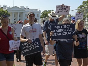 Protesters march from the White House to the Russian ambassador's residence in Washington, Saturday, Sept. 16, 2017, during a rally encouraging leaders to defend American democracy from Russian interference. (AP Photo/Susan Walsh)