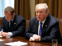 President Donald Trump, sitting next to Democratic Rep. Josh Gottheimer, speaks during a meeting with a bipartisan group of lawmakers at the White House, Sept. 13, 2017.