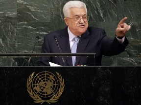 FILE - In this Wednesday, Sept. 20, 2017 file photo, Palestinian President Mahmoud Abbas speaks during the United Nations General Assembly at U.N. headquarters. Overshadowed by last week's showdown at the U.N. between the U.S. and North Korea, Abbas issued an ominous warning in his address to the world body. With hopes running out for an independent Palestinian state, the Palestinian leader said he may have no choice but to seek a single, binational state with Israel. (AP Photo/Seth Wenig, File)