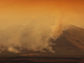 A large wild fire continues to burn in Waterton Lakes National Park, Alta. on September 12, 2017. THE CANADIAN PRESS/David Rossiter