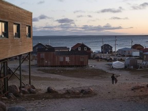 Residents walk down the hill to their home in the town of Gjoa Haven, Nunavut, on Friday September 1, 2017. THE CANADIAN PRESS/Jason Franson