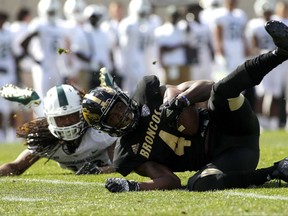 Western Michigan's Darius Phillips, right, intercepts a pass intended for Michigan State's Felton Davis III, left, during the second quarter of an NCAA college football game, Saturday, Sept. 9, 2017, in East Lansing, Mich. (AP Photo/Al Goldis)