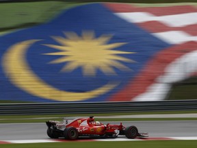 Ferrari driver Sebastian Vettel of Germany steers his car during the second practice for the Malaysian Formula One Grand Prix in Sepang, Malaysia, Friday, Sept. 29, 2017. (AP Photo/Eric To)