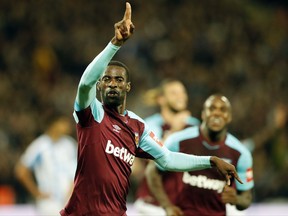 West Ham's Pedro Obiang celebrates after scoring his side's first goal during the English Premier League soccer match between West Ham United and Huddersfield Town at London Stadium in London, Monday, Sept. 11, 2017.(AP Photo/Frank Augstein)