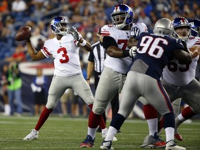 New York Giants quarterback Geno Smith (3) passes under pressure from New England Patriots nose tackle Darius Kilgo (96) during the first half of an NFL preseason football game, Thursday, Aug. 31, 2017, in Foxborough, Mass. (AP Photo/Winslow Townson)