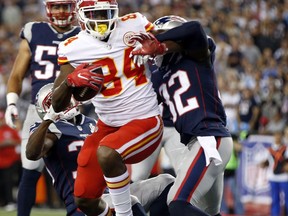 Kansas City Chiefs tight end Demetrius Harris (84) catches a touchdown pass as New England Patriots safety Devin McCourty (32) defends during the first half of an NFL football game, Thursday, Sept. 7, 2017, in Foxborough, Mass. (AP Photo/Michael Dwyer)