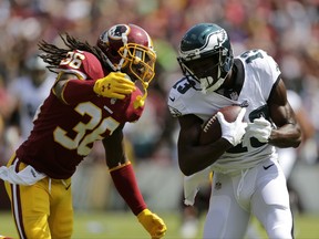 Philadelphia Eagles wide receiver Nelson Agholor, right, rushes past Washington Redskins free safety D.J. Swearinger for a touchdown in the first half of an NFL football game, Sunday, Sept. 10, 2017, in Landover, Md. (AP Photo/Mark Tenally)