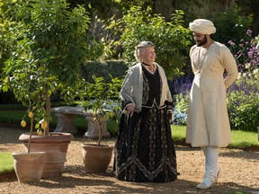 Judi Dench, left, and Ali Fazal appear in a scene from Victoria and Abdul.