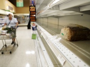 A lone loaf of bread sits on the shelf in a supermarket as some stores began reopening in the wake of Hurricane Irma in Fort Myers, Fla., Wednesday, Sept. 13, 2017. (AP Photo/David Goldman)