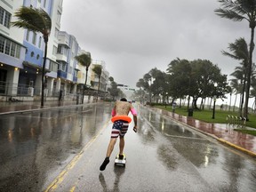 Funky Matas skateboards along South Beach as the effects of Hurricane Irma are felt in Miami Beach, Fla., Saturday, Sept. 9, 2017. (AP Photo/David Goldman)