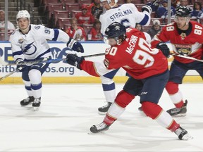 Florida Panthers center Jared McCann (90) shoots the puck and scores during the first period of an NHL preseason hockey game against the Tampa Bay Lightning, Thursday, Sept. 28, 2017, in Sunrise, Fla. (AP Photo/Joel Auerbach)