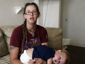 This Sept. 22, 2017 photo shows Shelby Hoogendyk and her 17 month-old son Caelan, at the St. Francis House in St. Augustine, Fla. Hoogendyk, her son and husband were evacuated from the homeless shelter during Hurricane Irma. When they arrived at a hurricane shelter they were segregated from the rest of the evacuees. Advocated for the homeless say the ill treatment of homeless people during disasters is a national problem that reflects the lack of state and local emergency planning to deal with that population. (AP Photo/Jason Dearen)