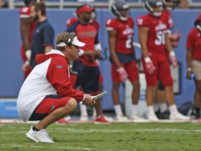 FILE - In this April 22, 2017, file photo, New Florida Atlantic coach Lane Kiffin watches players in Boca Raton, Fla. Florida Atlantic faces Wisconsin on Saturday. If might be tough enough for the Owls (0-1) to focus on a game in which they will be decided underdogs. They may have a new high-profile coach in Kiffin, but the talent level doesn't match the team that they'll have to face on the road at Camp Randall Stadium. ( Jim Rassol/South Florida Sun-Sentinel via AP, File)