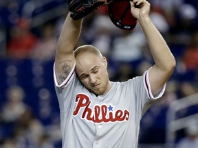 Philadelphia Phillies starting pitcher Jake Thompson wipes his face during the first inning of a baseball game against the Miami Marlins, Sunday, Sept. 3, 2017, in Miami. (AP Photo/Lynne Sladky)