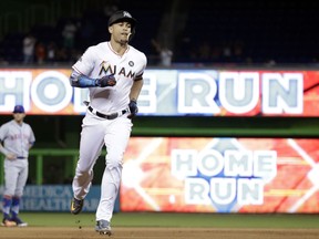 Miami Marlins' Giancarlo Stanton runs the bases after hitting a three-run home run during the fourth inning of a baseball game against the New York Mets, Monday, Sept. 18, 2017, in Miami. (AP Photo/Lynne Sladky)