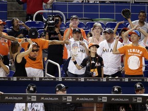 Fans cheer as Miami Marlins' Ichiro Suzuki comes up to bat during the seventh inning of a baseball game against the New York Mets, Monday, Sept. 18, 2017, in Miami. The Marlins won 13-1. (AP Photo/Lynne Sladky)