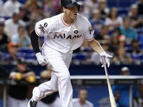 Miami Marlins' Brian Anderson heads to first base as he grounds out during his first at-bat in the majors, during the first inning of a baseball game against the Philadelphia Phillies, Friday, Sept. 1, 2017, in Miami. (AP Photo/Wilfredo Lee)