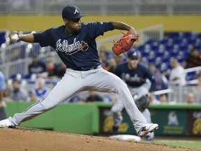 Atlanta Braves' Julio Teheran delivers a pitch during the first inning of a baseball game against the Miami Marlins, Thursday, Sept. 28, 2017, in Miami. (AP Photo/Wilfredo Lee)