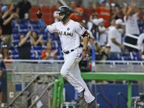 Miami Marlins' Giancarlo Stanton celebrates after he hit a home run during the fifth inning of a baseball game against the Washington Nationals, Monday, Sept. 4, 2017, in Miami. (AP Photo/Wilfredo Lee)