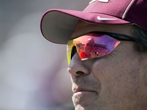 North Carolina State head coach Dave Doeren is reflected in Florida State head coach Jimbo Fisher's glasses as they talk before an NCAA college football game in Tallahassee, Fla., Saturday, Sept. 23, 2017. (AP Photo/Mark Wallheiser)